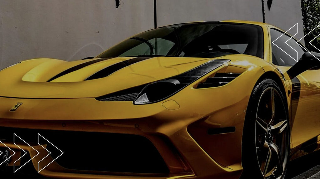An image of a yellow Ferrari